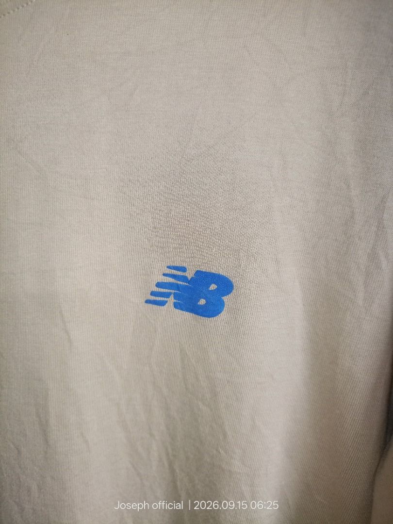 New Balance T-Shirt Size M (Category: Shirts) located in Caloocan City. Submitted by kingjose_16 (Listing ID 1461794129, Image 3). Description: - Brand New Balance T-shirt - Size: Medium (M) - Design: Small blue NB logo on chest - Back Graphic: Person cycling with 'Ride with your rhythm' text - Origin: Made in Vietnam.