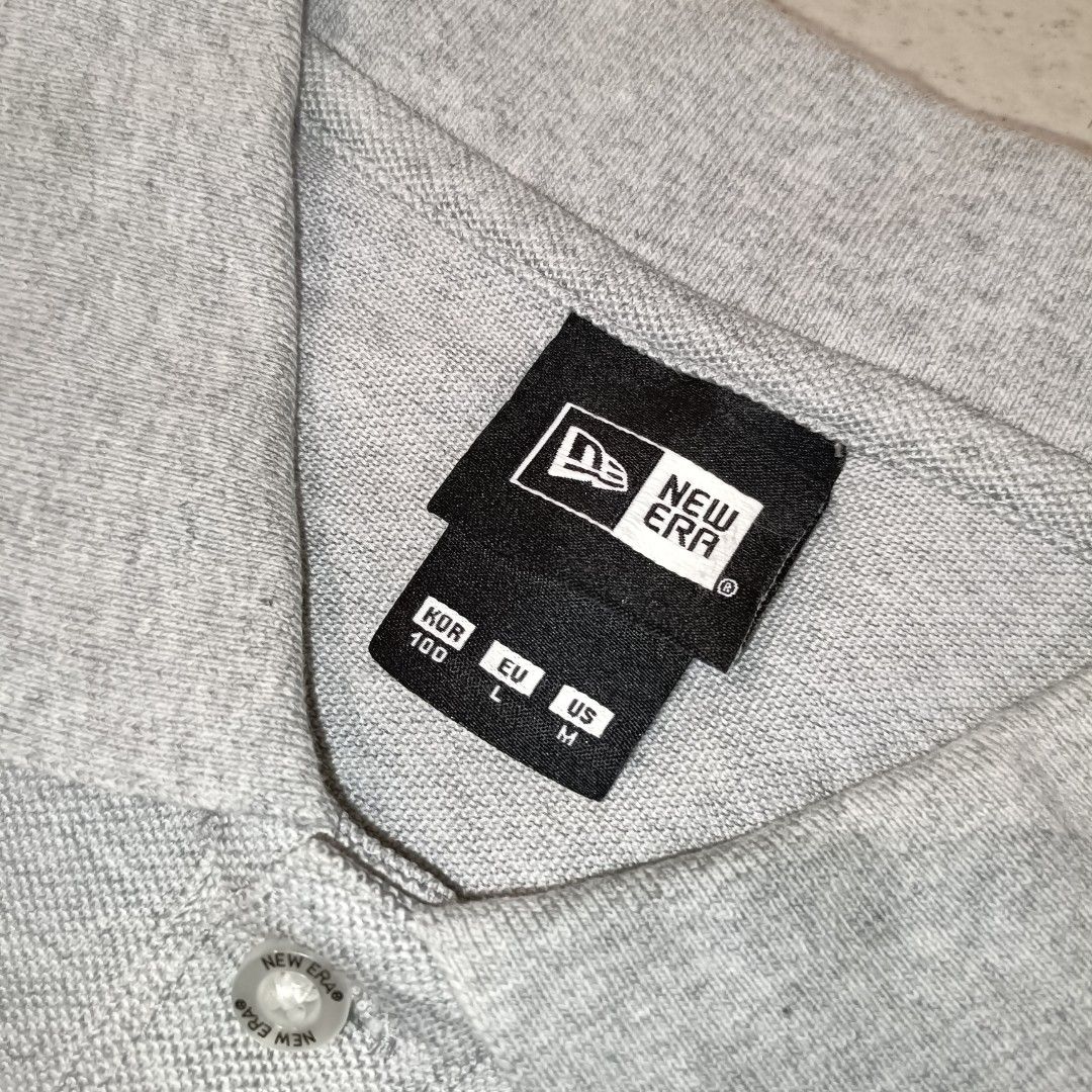 New Era Polo Shirt (Category: Tshirts & Polo Shirts ) located in Cebu City. Submitted by findwaze6000 (Listing ID 1461755749, Image 3). Description: EXCELLENT TO NEW❗ SIZE LARGE ON TAG WIDTH: 21.5 LENGTH: 27.5 BACK 28.5 NO ISSUE COLOR: GREY EMBROIDERY LOGO ✅ MATERIAL: 53% COTTON / 47% POLYESTER LOCATION: CEBU CITY📍.
