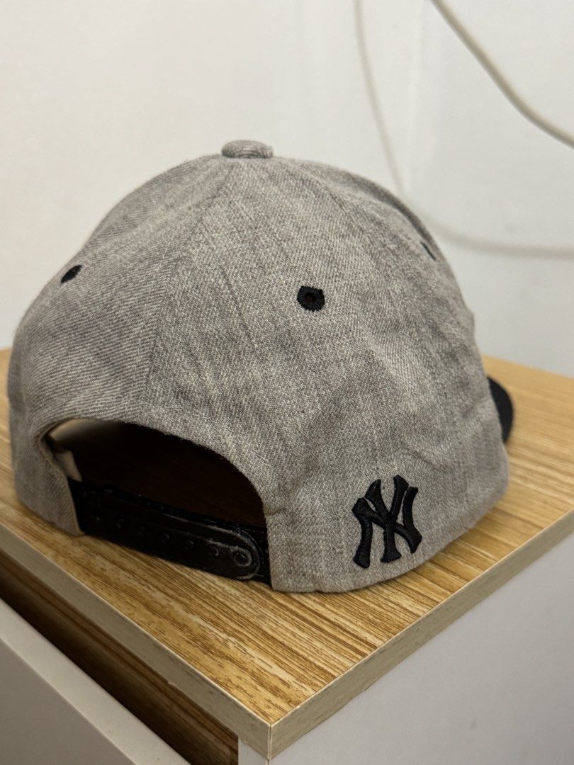 New York Yankees MLB Baseball Cap Grey Black (Category: Caps & Hats) located in Bulacan. Submitted by alshopie (Listing ID 1461629767, Image 2). Description: - Grey New York Yankees cap - Black brim - Yankees logo on the front - MLB logo on the side - NY logo on the back - Adjustable strap for a custom fit - Ideal for any New York Yankees fan.