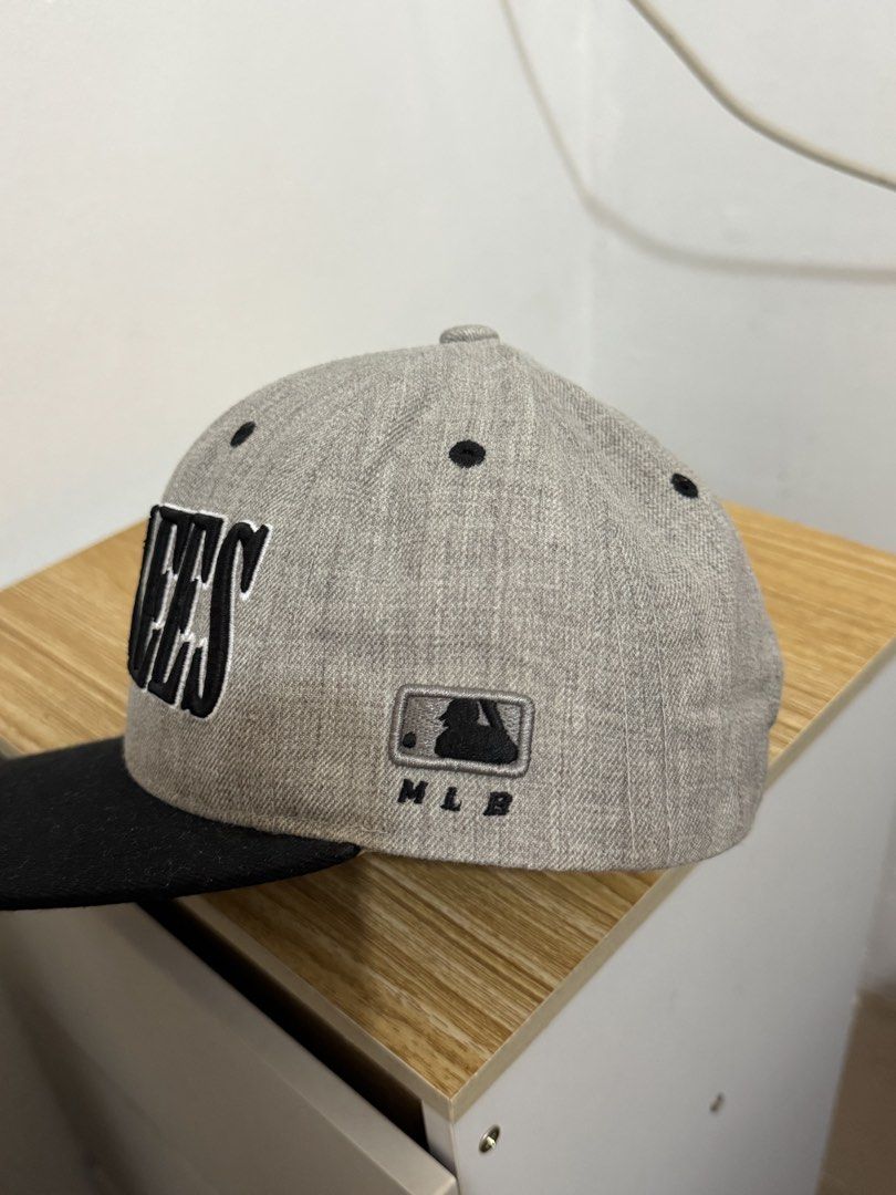 New York Yankees MLB Baseball Cap Grey Black (Category: Caps & Hats) located in Bulacan. Submitted by alshopie (Listing ID 1461629767, Image 3). Description: - Grey New York Yankees cap - Black brim - Yankees logo on the front - MLB logo on the side - NY logo on the back - Adjustable strap for a custom fit - Ideal for any New York Yankees fan.