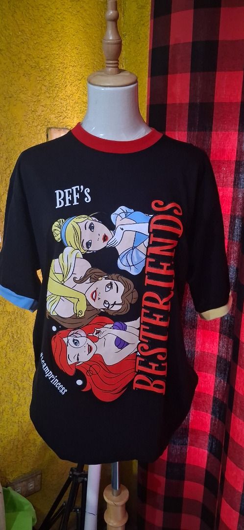Newmily Studio Disney Princess BFF's Ringer Tee (Category: Shirts) located in Manila. Submitted by katkween23 (Listing ID 1461607086, Image 1). Description: - Adorable pink ringer t-shirt - Features Disney Princesses Ariel, Belle, and Cinderella - Text reads 'BFF's Bestfriends' and '#teamprincess' - Contrasting red collar and sleeve trim - Made in Thailand by Newmily Studio - Ideal for Disney enthusiasts and best friends.