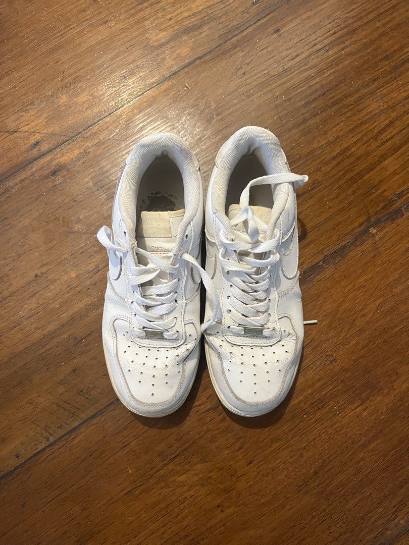 Nike Air Force 1 White Sneakers (Category: Sneakers) located in Pasig City. Submitted by martin.as (Listing ID 1461630264, Image 2). Description: - Classic white Nike Air Force 1s Bought in 2021 - Laces are intact - Great for everyday wear or customization.