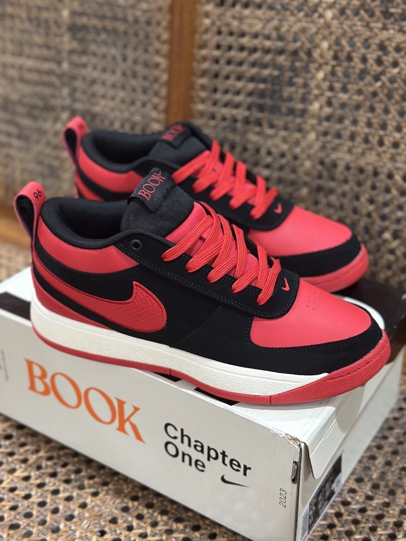 Nike Chapter One "BOOK" Red Black Sneakers (Category: Sneakers) located in San Rafael. Submitted by davemoya453442 (Listing ID 1461728818, Image 3). Description: - Nike sneakers in striking red and black colorway. - Features "Chapter One" branding on the heel tabs. - Soles are detailed with "AIR ZOOM" text. - Includes the original box for safekeeping. - Ideal for everyday casual wear..