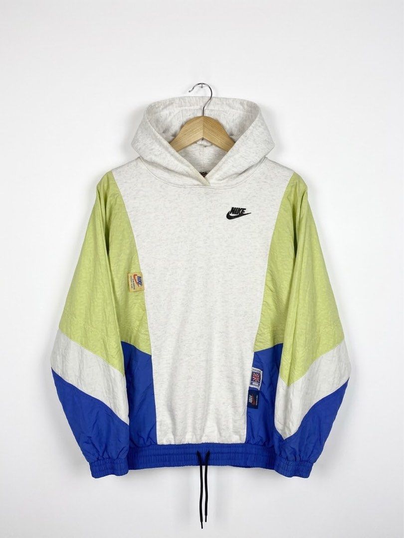 Nike Colorblock Hoodie (Category: Coats, Jackets and Outerwear) located in Manila. Submitted by thrift_hustler (Listing ID 1461794089, Image 1). Description: - Stylish Nike colorblock hoodie - Features panels in white, lime green, and blue - Iconic Nike logo embroidered on the chest - Adjustable drawstring at the hem for a custom fit - Ideal for everyday casual wear.
