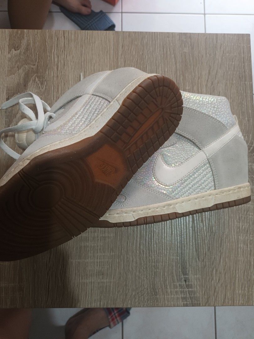 Nike Dunk High White Iridescent Sneakers (Category: Sneakers) located in Cainta. Submitted by ma_tres (Listing ID 1461594718, Image 2). Description: - White Nike Dunk Highs - Features an iridescent, textured overlay - Classic high-top silhouette - White laces - Gum brown soles - Pre-owned, but with plenty of life left - Perfect for everyday casual wear.