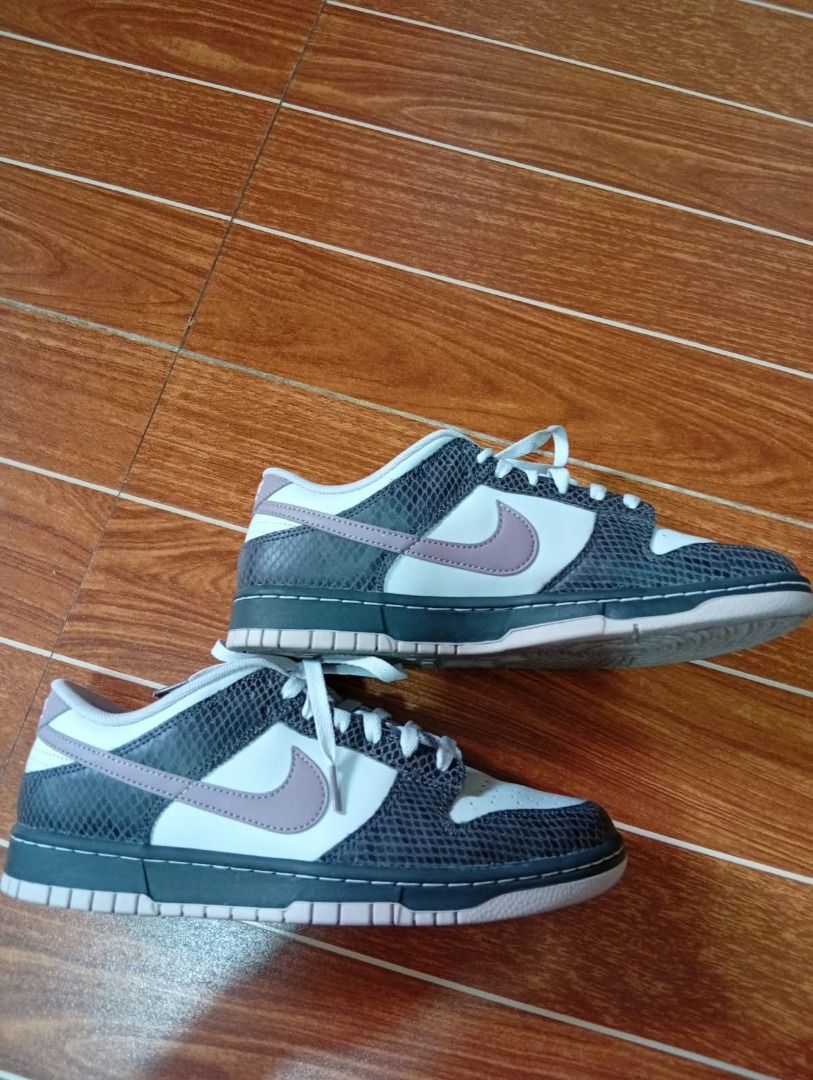 Nike Dunk Low SE Medium Ash Violet Snakeskin (Category: Sneakers) located in Caloocan City. Submitted by grandmountain_ca5a79 (Listing ID 1461638348, Image 2). Description: - Nike Dunk Low - Eye-catching grey snake pattern - Clean white perforated toe box - Crisp white laces - Classic low-top silhouette - Perfect for everyday casual style.