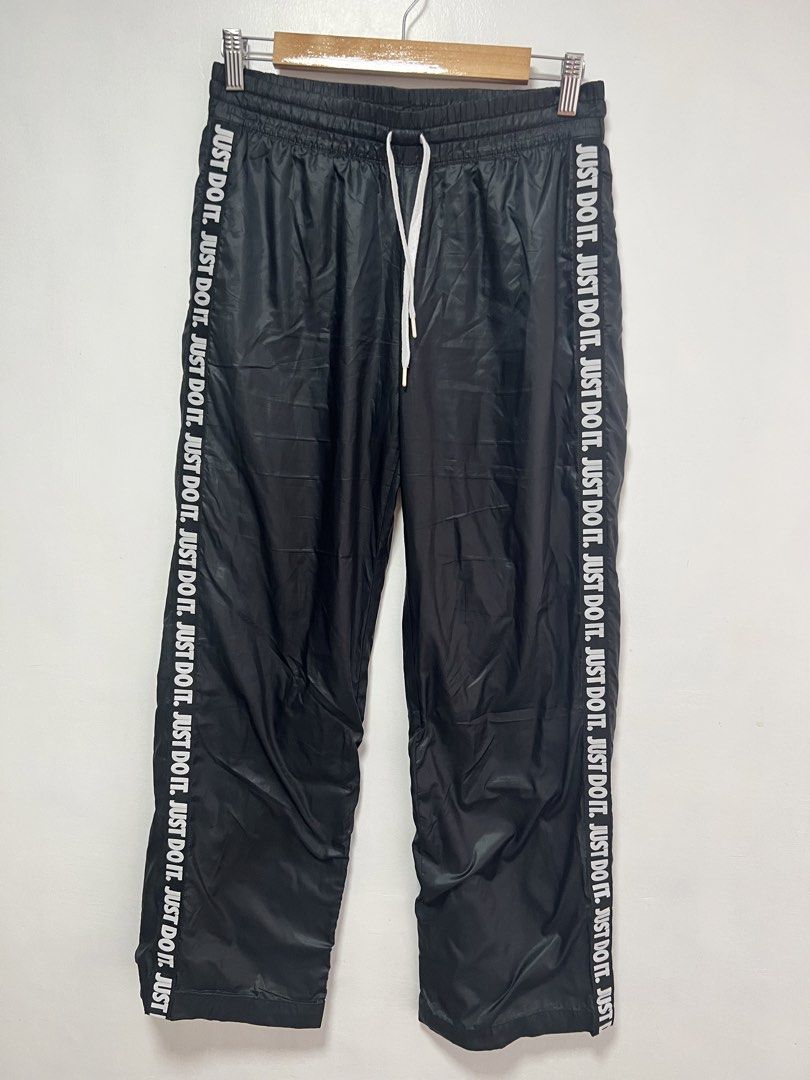 Nike nylon track pants “ JUST DO IT” side tape (Category: Activewear) located in Muntinlupa City. Submitted by thriftdripbyjm (Listing ID 1461727838, Image 1). Description: Color rate: 10/10 as new Dimes: 14x37 (M on tag) Hemline: 9 Issue: none Price: 850+sf.