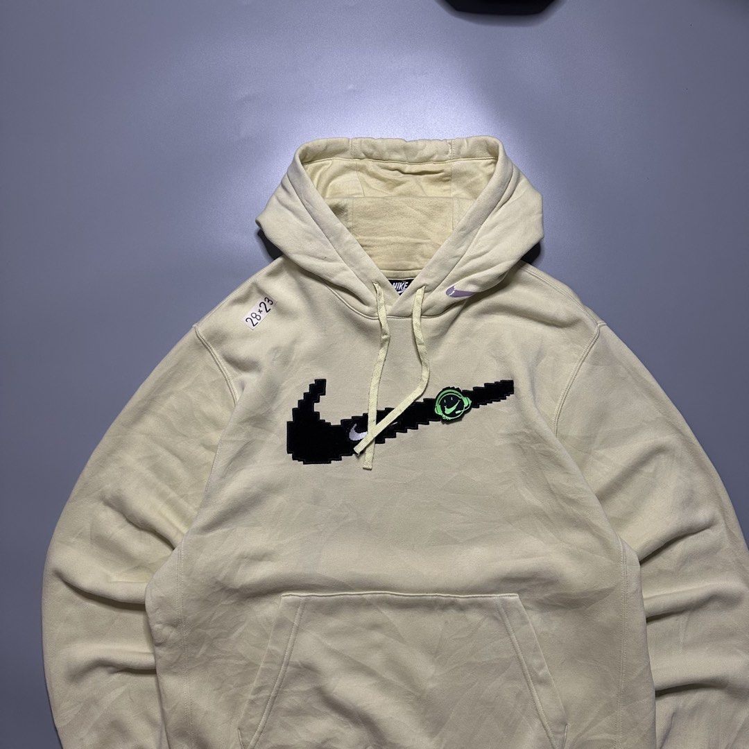 Nike Pixel Swoosh Hoodie Jacket (Category: Coats, Jackets and Outerwear) located in Baguio. Submitted by subaitems (Listing ID 1461628090, Image 2). Description: - Yellow Nike Hoodie - Size: XL - Pixelated Swoosh graphic - Kangaroo pocket - Drawstring hood.