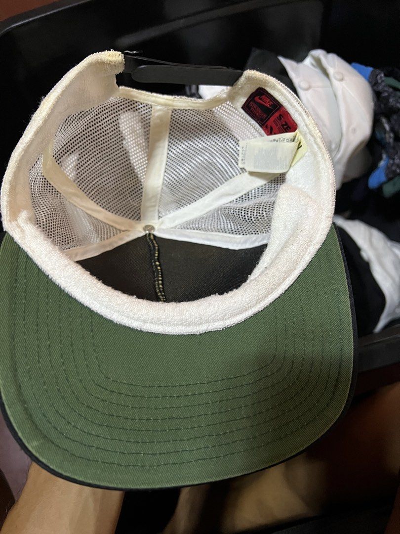 Nike Stranger Things Hawkins High School Trucker Cap (Category: Caps & Hats) located in Davao. Submitted by dubdabi.co (Listing ID 1461780223, Image 3). Description: - Hawkins High School Tiger trucker cap - Nike x Stranger Things collaboration - White mesh back for breathability - Green underbrim - Adjustable snapback closure - Shows some signs of wear on brim and sweatband.