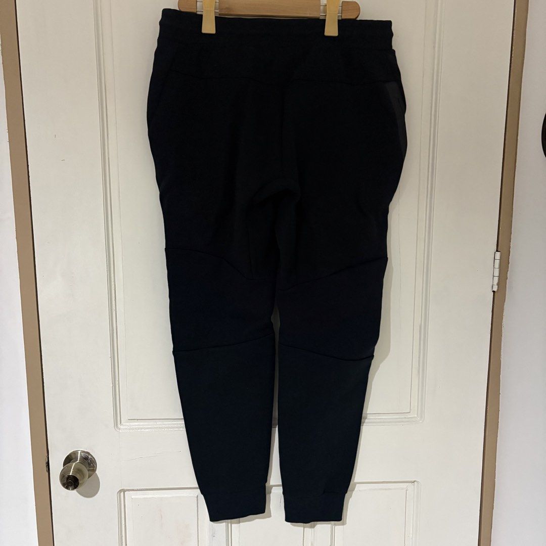 Nike Tech Fleece Joggers Black (Category: Joggers) located in Dapitan. Submitted by payt3es_thrift. (Listing ID 1461739551, Image 3). Description: NI~KE TECH FLEECE BLACK JOGGER PANTS 🖤 Clean and premium-looking Ni-ke joggers — perfect for casual wear, travel, gym, or everyday streetwear. ✅ Size: XL ✅ Color: Black 9.9/10 ✅ Drawstring elastic waistband ✅ Signature side zipper pocket ✅ Tapered jogger fit ✅ Ribbed ankle cuffs ✅ Ni-ke logo on front 