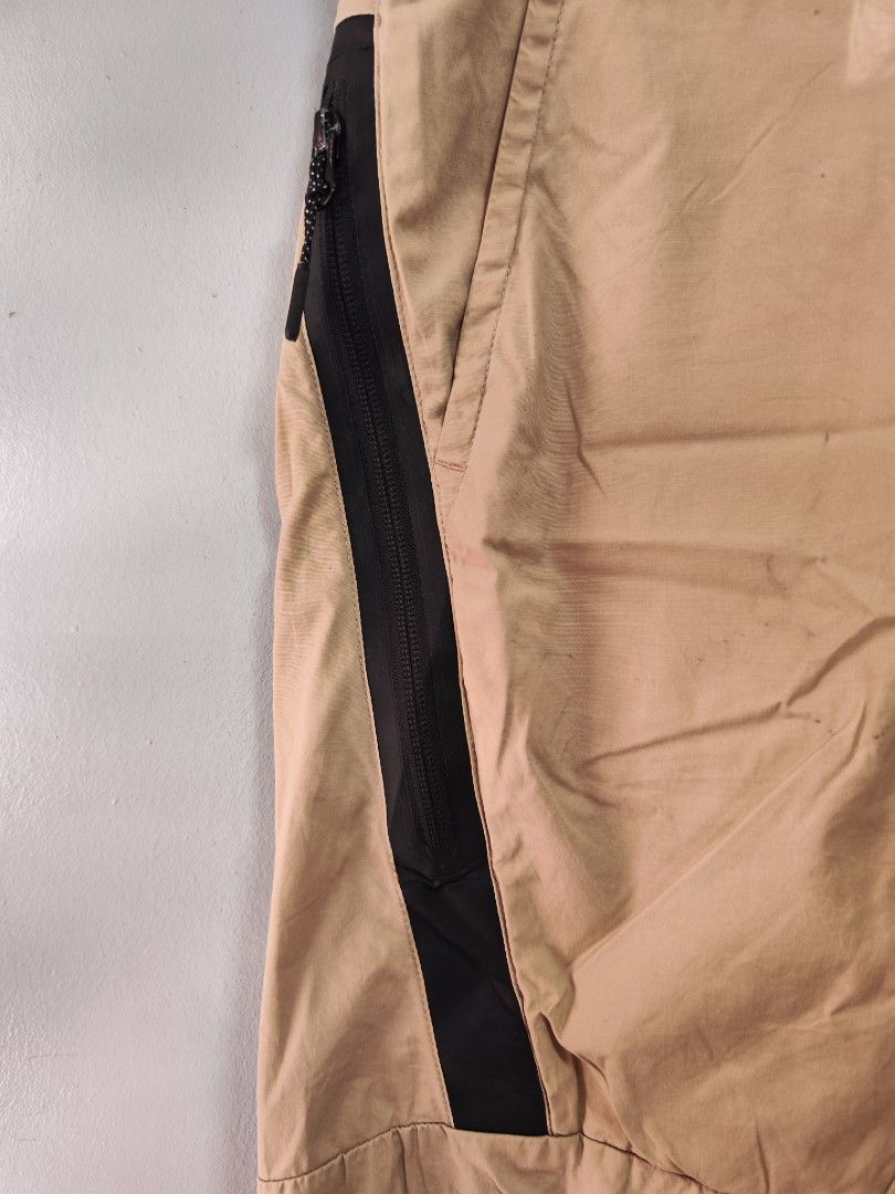 Nike Tech Nylon Beige Shorts (Category: Shorts) located in Bulacan. Submitted by emilj23 (Listing ID 1461689890, Image 3). Description: Nike Tech Nylon Beige Shorts Size M on tag L 20 W 32 Leg Hole 9 Condition 9/10 Color rate 9.5/10 Issue Minimal Stains Pinholes.