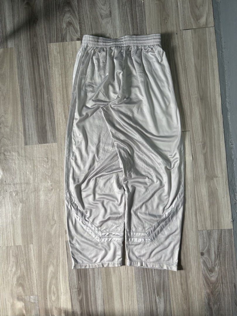 Nike Track Pants White (Category: Joggers) located in Rizal. Submitted by thriftdrip.402 (Listing ID 1461703163, Image 3). Description: - White Nike track pants - Elastic waistband with drawstring - Zippers at the ankle - Classic Nike swoosh logo on the front - Small logo patch on the side near the zipper - Ideal for sports or casual wear - Free waist - Length 42, Thigh 16, Leg Hole 10.