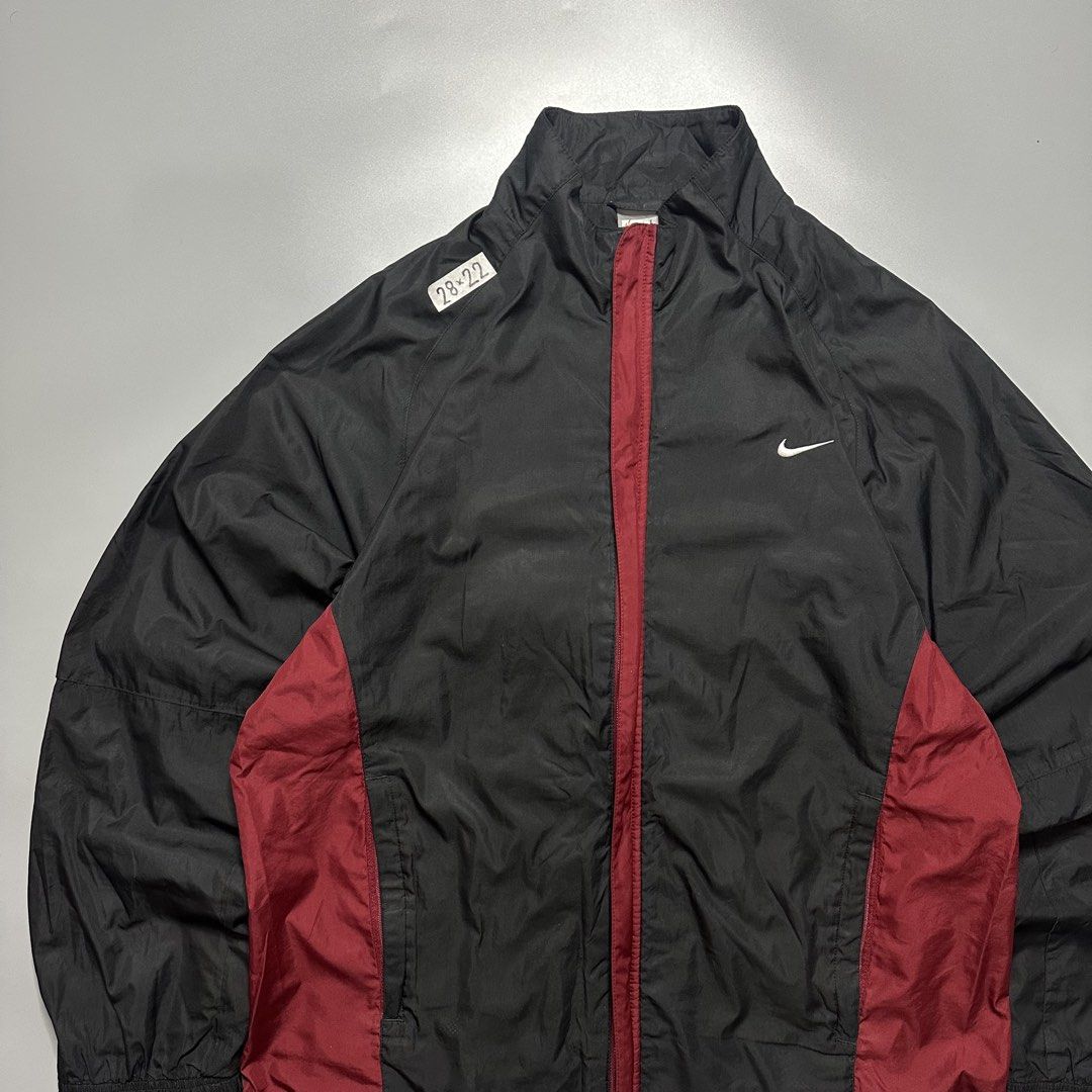 NIKE WINDBREAKER TRACK JACKET (Category: Coats, Jackets and Outerwear) located in Baguio. Submitted by subaitems (Listing ID 1461626813, Image 2). Description: - Classic Nike track jacket - Color: Black with maroon side panels - Features: Full zip front, stand-up collar, elasticated cuffs and hem - Technology: Nike Fit Storm - Size: L - Ideal for: Workouts or casual wear.