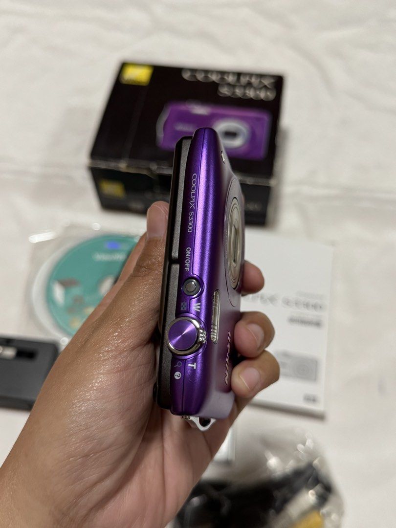 Nikon Coolpix S3300 (purple) (Category: Cameras) located in Baguio. Submitted by everythingmustgo2600 (Listing ID 1461562868, Image 3). Description: 16 megapixel 6x optical zoom Nikkor lens (26-156mm equivalent), 720p HD video recording, and lens-shift image stabilization. CONDITION: > in good working condition > has minor scratch but unit is still presentable (please refer to photos for body condition) > all buttons tested, zoom in/out tested, f