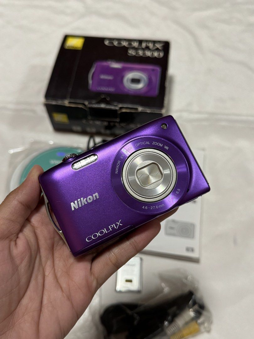 Nikon Coolpix S3300 (purple) (Category: Cameras) located in Baguio. Submitted by everythingmustgo2600 (Listing ID 1461562868, Image 2). Description: 16 megapixel 6x optical zoom Nikkor lens (26-156mm equivalent), 720p HD video recording, and lens-shift image stabilization. CONDITION: > in good working condition > has minor scratch but unit is still presentable (please refer to photos for body condition) > all buttons tested, zoom in/out tested, f