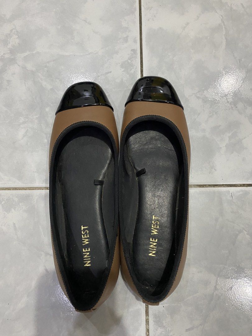Nine West Brown Cap Toe Ballet Flats (Category: Flats & Sandals) located in Manila. Submitted by elyssedel75237 (Listing ID 1461728887, Image 1). Description: - Brand: Nine West - Color: Brown with black cap toe detail - Style: Ballet flats, slip-on - Features: Comfortable, versatile for casual or dressy outfits - Condition: Good.