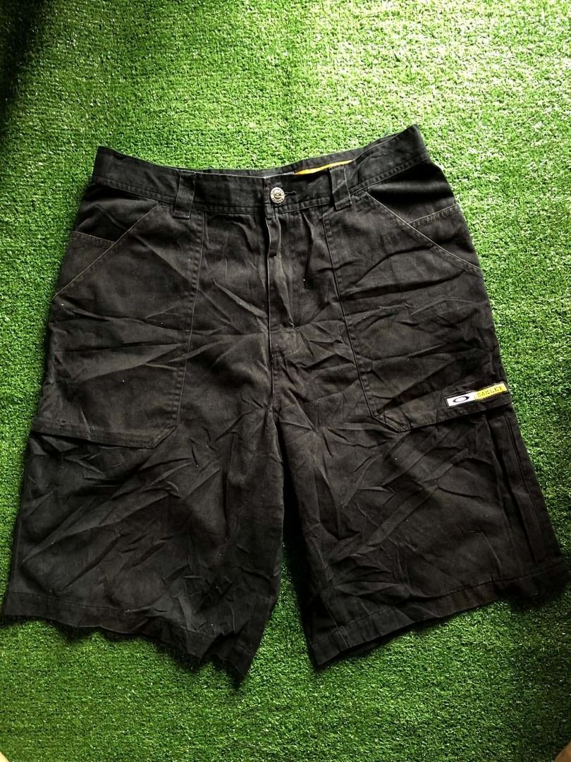 Oakley "Software" Cargo Shorts Size 32 Black (Category: Shorts) located in Bunawan. Submitted by thriftbykel (Listing ID 1461604262, Image 2). Description: - Oakley black shorts - Size 32 - "Software" button detail - Oakley branding on side pocket - Distinctive orange and white stripe along side seam - Multiple pockets for ample storage - Ideal for casual wear.