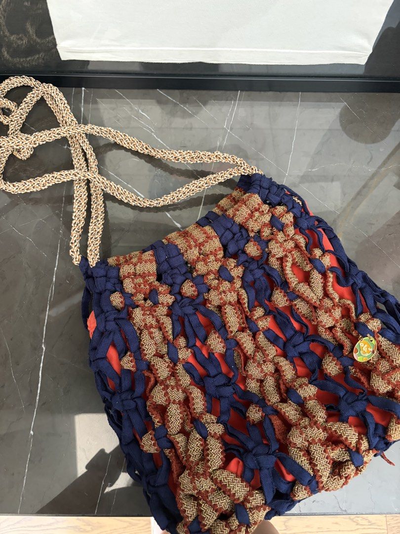 Ola House Bag (Category: Shoulder Bags) located in Paranaque City. Submitted by abcmnda1230 (Listing ID 1461597350, Image 1). Description: - Unique woven crochet shoulder bag - Features a vibrant red lining inside - Matching woven strap for a cohesive look - Ideal for casual outings - Adds a stylish pop of color to any outfit.
