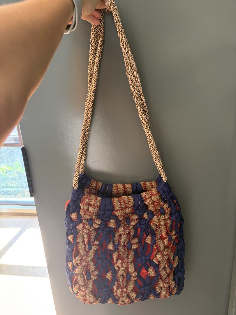 Ola House Bag (Category: Shoulder Bags) located in Paranaque City. Submitted by abcmnda1230 (Listing ID 1461597350, Image 3). Description: - Unique woven crochet shoulder bag - Features a vibrant red lining inside - Matching woven strap for a cohesive look - Ideal for casual outings - Adds a stylish pop of color to any outfit.