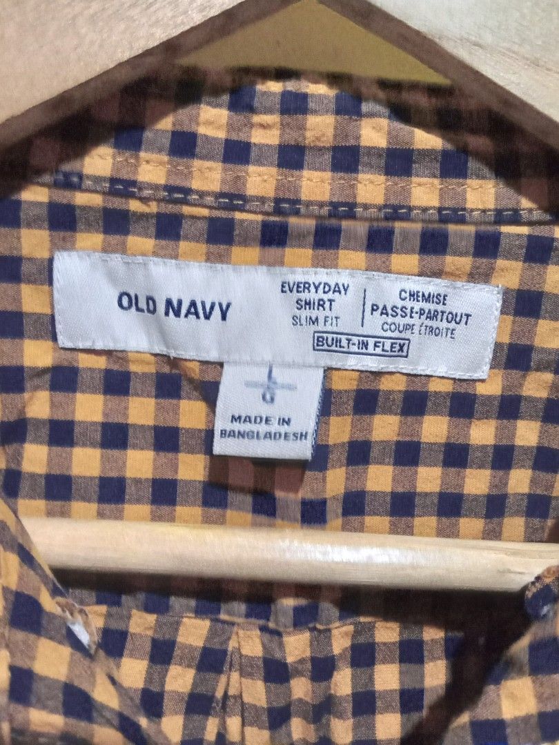 Old Navy Gingham Long Sleeve Shirt (Category: Formal Shirts) located in San Fernando. Submitted by _luxielleph (Listing ID 1461796985, Image 2). Description: - Brand: Old Navy - Color: Orange and Navy Gingham - Style: Long sleeve, button-up shirt - Pattern: Classic checkered - Size: L - Perfect for: Casual wear or layering.