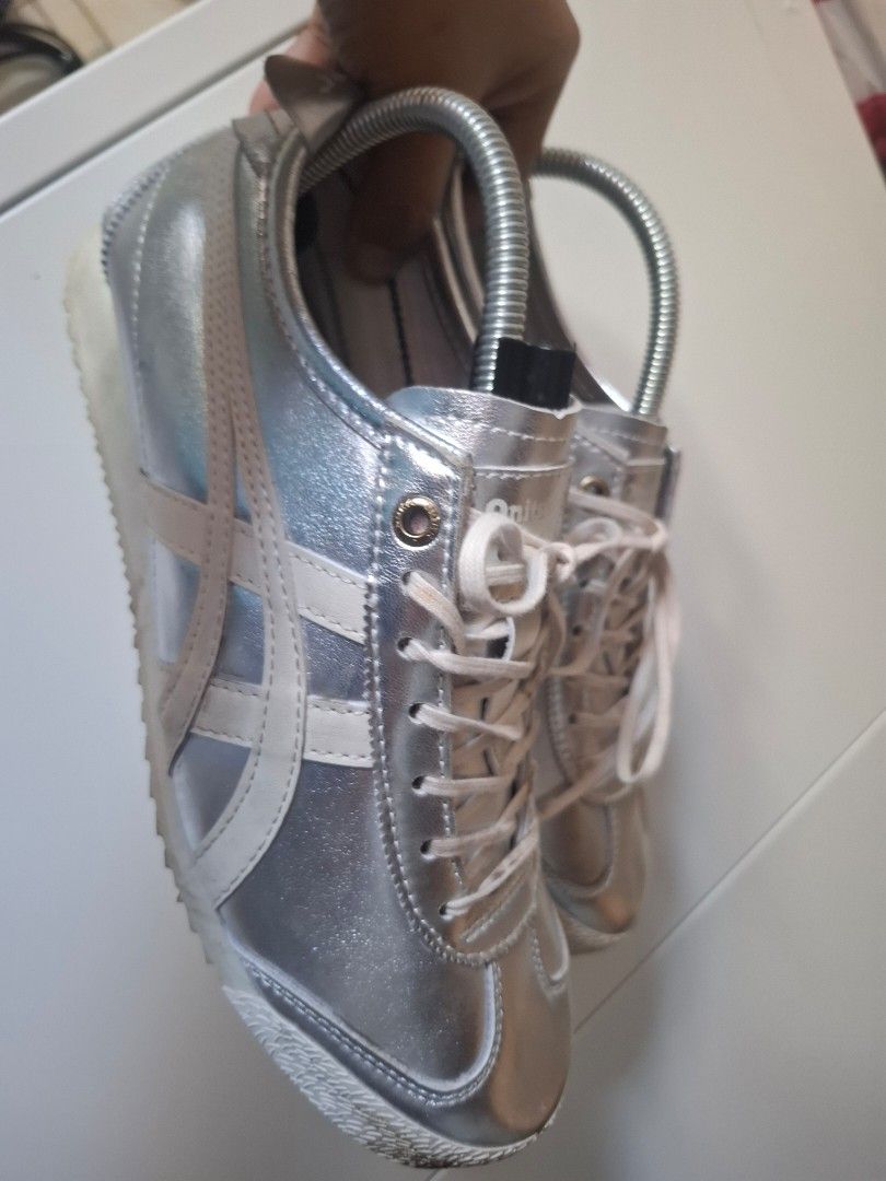 Onitsuka Tiger Mexico 66 Silver Metallic Sneakers (Category: Sneakers) located in Marikina City. Submitted by bags21.ph (Listing ID 1461602015, Image 2). Description: - Authentic Onitsuka Tiger Mexico 66 sneakers - Stunning metallic silver finish - Classic white stripes and laces - Ideal for everyday casual wear - Comes with original shoe trees inside - Ready for its next adventure with you!.