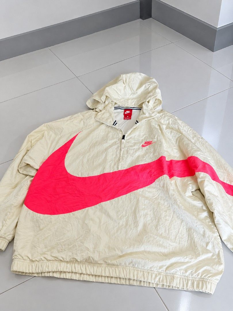 Orig (Category: Coats, Jackets and Outerwear) located in Bulacan. Submitted by ukaybrandedshop (Listing ID 1461564701, Image 1). Description: FOR SALE Nike Big Swoosh Windbreaker 🌈🔥 Nike Big Swoosh Woven Jacket Color: Sail / Cream x Hot Pink Swoosh Size L on tag - fits L to XL W: 24 x L: 27 Condition: Good / Makapal / No pinhole / No crack print Issue: Need wash lang, may light yellow stain sa may zipper (kita sa pic) pero matatanggal yan sa ba