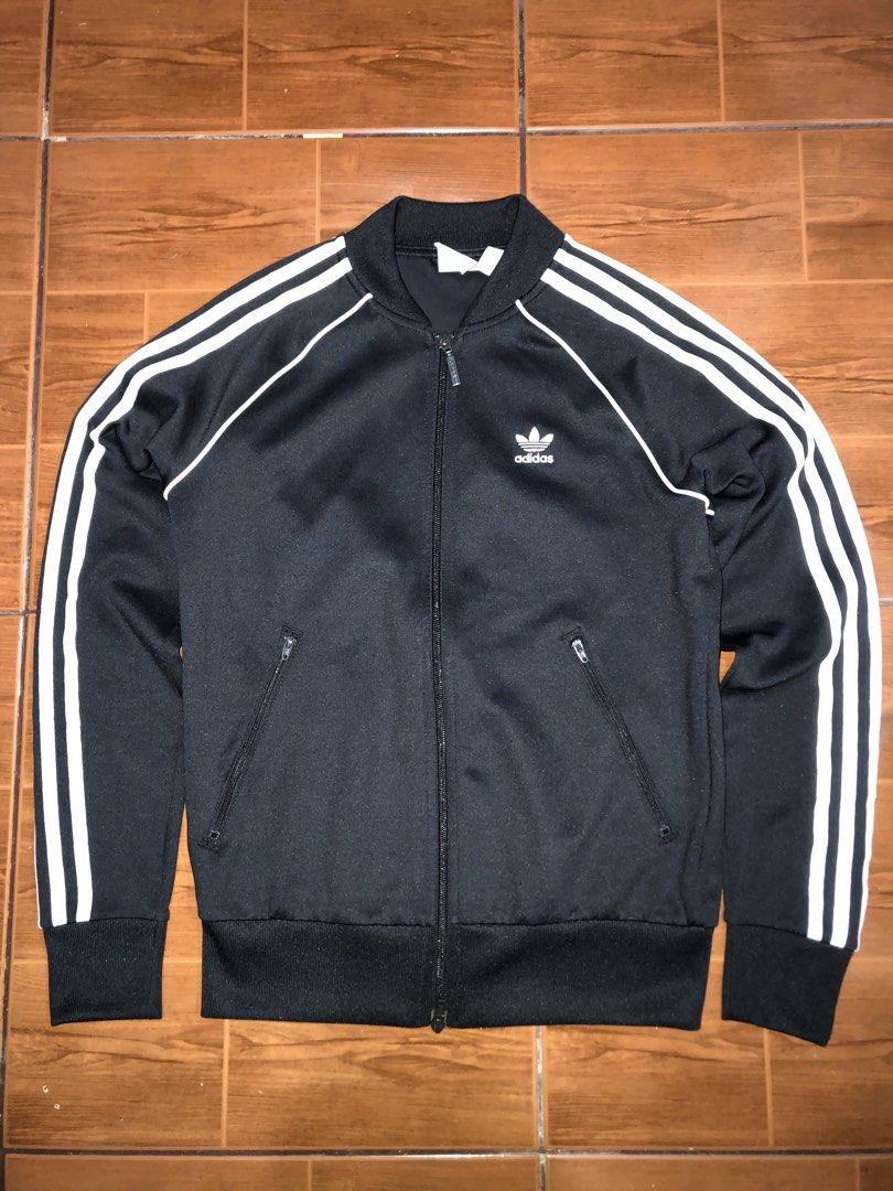 Original Adidas TrackJacket (Category: Coats, Jackets and Outerwear) located in San Juan City. Submitted by prettyboi_ (Listing ID 1461673793, Image 1). Description: GOOD CONDITION OVERALL COLOR RATE 10/10 NO ISSUE USE TWICE SAN JUAN CITY LOCATION VIA LALAMOVE FEE YOURS.