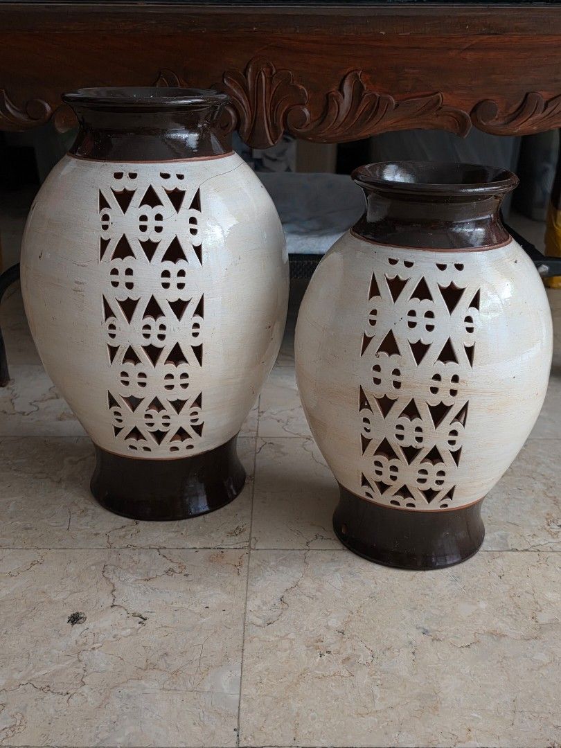 Pair of Ceramic Vases with Cutout Pattern (Category: Vases & Decorative Bowls) located in Caloocan City. Submitted by bravemountain_ddc4bf (Listing ID 1461614803, Image 2). Description: - Set of 2 ceramic vases - Cream color with dark brown accents - Unique cutout geometric pattern - Ideal for home decor or as a statement piece - Approx. [width] at widest point.