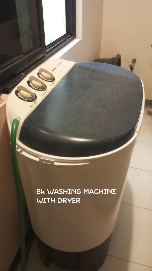 Panasonic Washing Machine with Dryer (Category: Washing Machines and Dryers) located in Manila. Submitted by thriftpulse (Listing ID 1461668705, Image 1). Description: - Panasonic Washing Machine with Dryer Function - Color: White and Dark Grey - Features: Wash Timer and Cycle Selector Knobs - Includes: Green Inlet Hose - Condition: Works well - Ideal for: Small households.