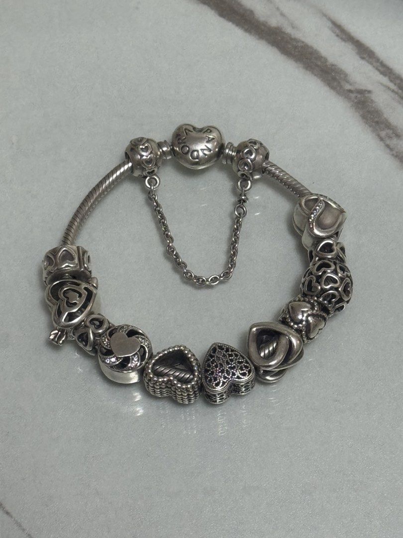 Pandora Sterling Silver Bracelet with Charms (Category: Bracelets) located in Angeles City. Submitted by cryanne6 (Listing ID 1461655183, Image 2). Description: - Authentic Pandora bracelet - Includes multiple charms - Features a safety chain - Comes with original Pandora box - Includes original Pandora shopping bag - Ideal gift for someone special.