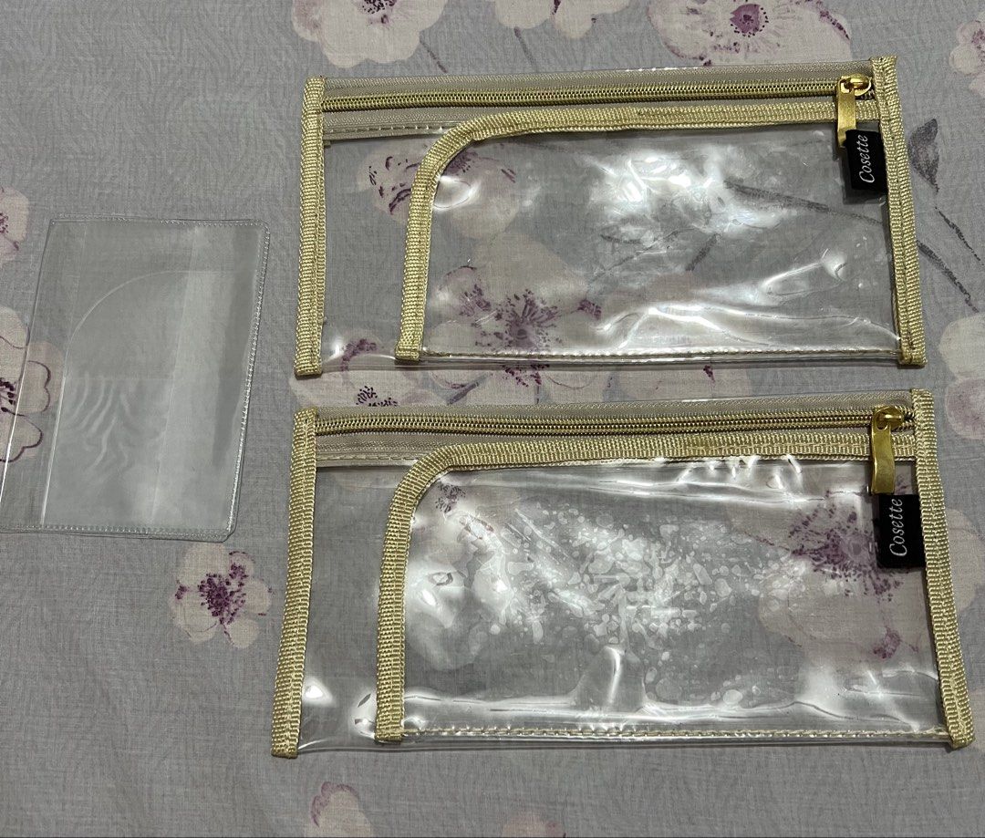 PASSPORT HOLDER SET (Category: Purses & Pouches) located in Caloocan City. Submitted by allotherthings26 (Listing ID 1461590728, Image 2). Description: - Set of 2 clear cosmetic pouches from Cosette - Features elegant gold trim and zippers - Includes an additional smaller clear sleeve - Ideal for organizing travel essentials - Transparent design allows for easy visibility of contents - Secure zipper closure.