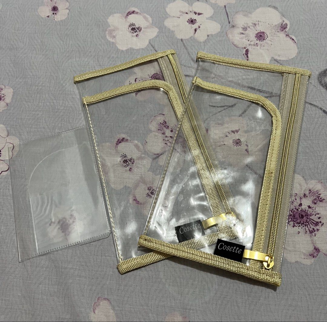 PASSPORT HOLDER SET (Category: Purses & Pouches) located in Caloocan City. Submitted by allotherthings26 (Listing ID 1461590728, Image 1). Description: - Set of 2 clear cosmetic pouches from Cosette - Features elegant gold trim and zippers - Includes an additional smaller clear sleeve - Ideal for organizing travel essentials - Transparent design allows for easy visibility of contents - Secure zipper closure.