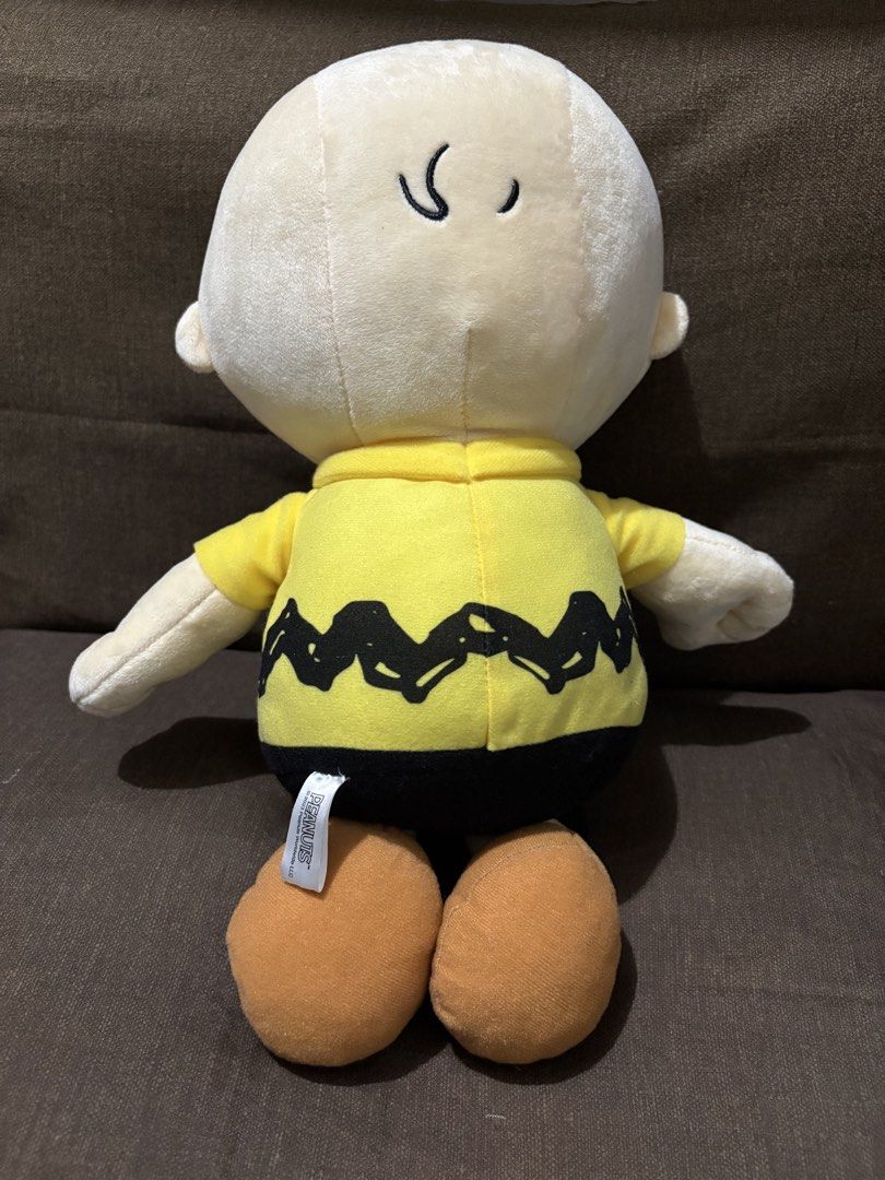 Peanuts Snoopy Charlie Brown Plush (Category: Plushies & Soft Toys) located in Taguig. Submitted by goofysofties (Listing ID 1461689207, Image 2). Description: - Officially licensed Peanuts Charlie Brown plush toy. - Approximately 15 inches in height. - Features Charlie Brown’s classic outfit: yellow shirt with zig-zag stripe and black shorts. - Soft and huggable material. - A must-have for any Peanuts or Charlie Brown enthusiast..