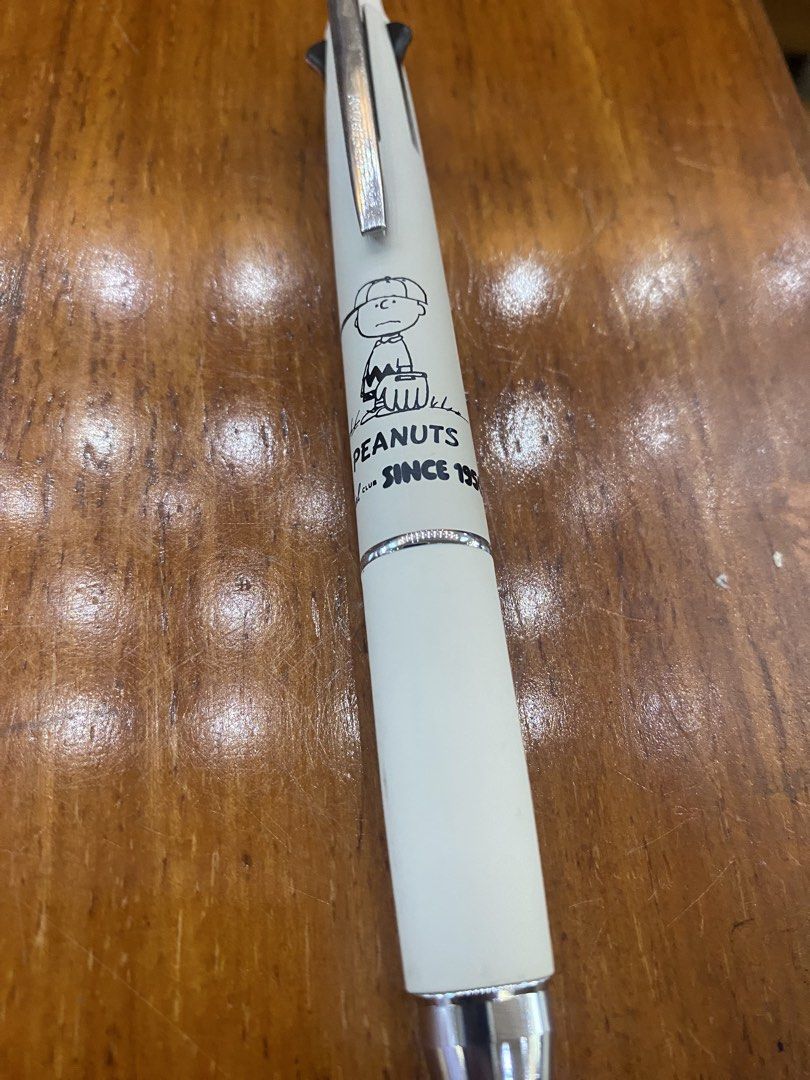 Peanuts Snoopy Multi-function Pen uniball (Category: Stationery & School Supplies) located in Batangas. Submitted by calcifer_06 (Listing ID 1461579007, Image 1). Description: - White multi-function pen featuring a fun Snoopy graphic. - Reads 'Peanuts Since 1950', celebrating a classic. - Designed with a comfortable grip for extended writing sessions. - Ideal for everyday use, making writing more enjoyable. - A fantastic collectible item for any 