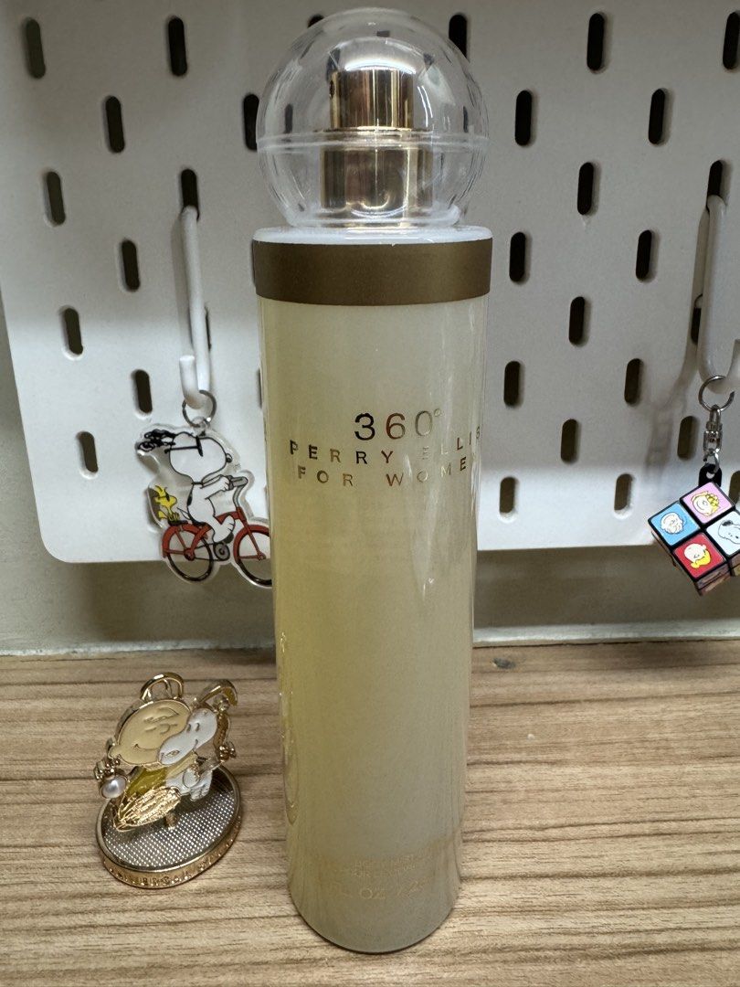 Perry Ellis 360° For Women Eau de Parfum (Category: Fragrance & Deodorants) located in Caloocan City. Submitted by xenasales (Listing ID 1461666886, Image 1). Description: - Perry Ellis 360° For Women Eau de Parfum - Tall, cylindrical bottle with a clear spherical cap - Pale yellow liquid inside - Includes a Snoopy keychain - Comes with a small decorative Snoopy charm.