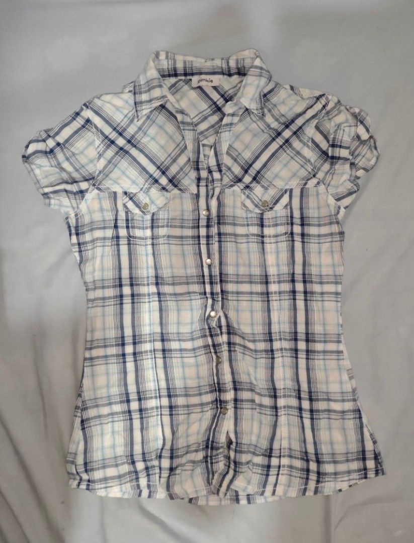 Pimkie Plaid Button-Up Shirt (Category: Shirts) located in Quezon. Submitted by strawberry_me (Listing ID 1461667824, Image 1). Description: - Cute blue and white plaid shirt from Pimkie - Short sleeves - Button-up front - Two chest pockets with button closures - Lightweight and comfortable fabric - Perfect for casual wear ‼️ STRICTLY: • No cancellation of orders • No return, no refund • No bogus buyers 💸 MODE OF PAYMENT: GCash.