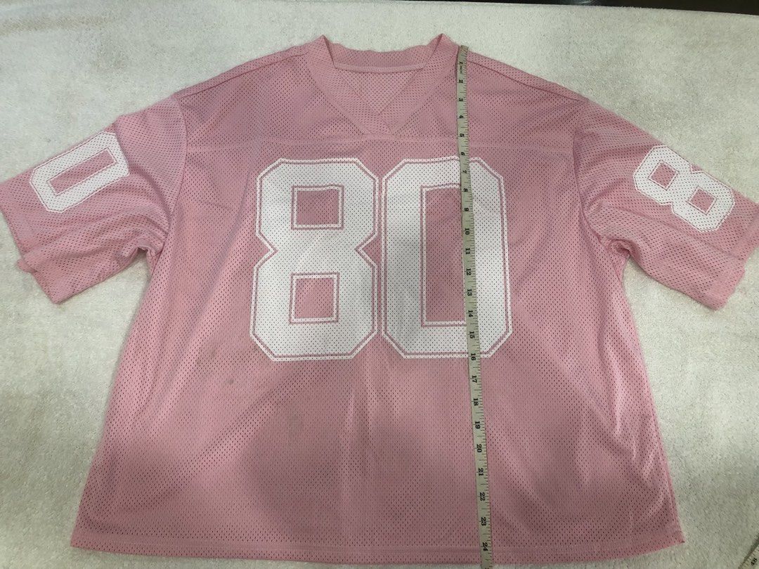 Pink "80" Jersey Top (Category: Shirts) located in Manila. Submitted by janmichael26601 (Listing ID 1461609502, Image 1). Description: - Pink mesh jersey - Features '80' graphic on front and sleeves - Short sleeves - V-neck design - Versatile for casual wear or costumes - Measurements: Pit to pit approx. 24 inches, Length approx. 28 inches.