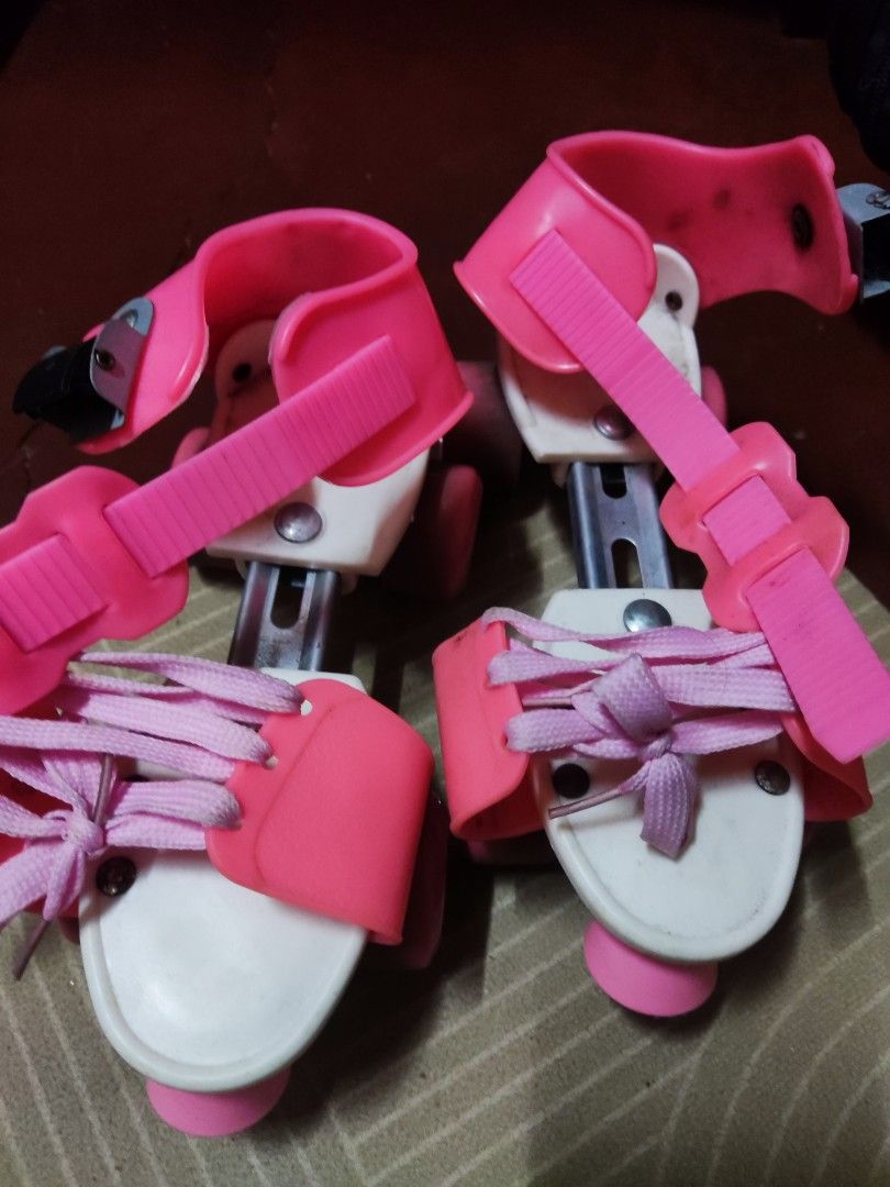 Pink Adjustable Roller Skates for Kids (Category: Skates, Rollerblades & Scooters) located in Pateros City. Submitted by starry__night__20951 (Listing ID 1461589210, Image 1). Description: - Adjustable roller skates for kids - Bright pink and white design - Secure fit with laces and velcro straps - Pink wheels - Ideal for learning to skate - Shows some scuffs on wheels from use, but still in great working condition and lots of fun left! Orig pric