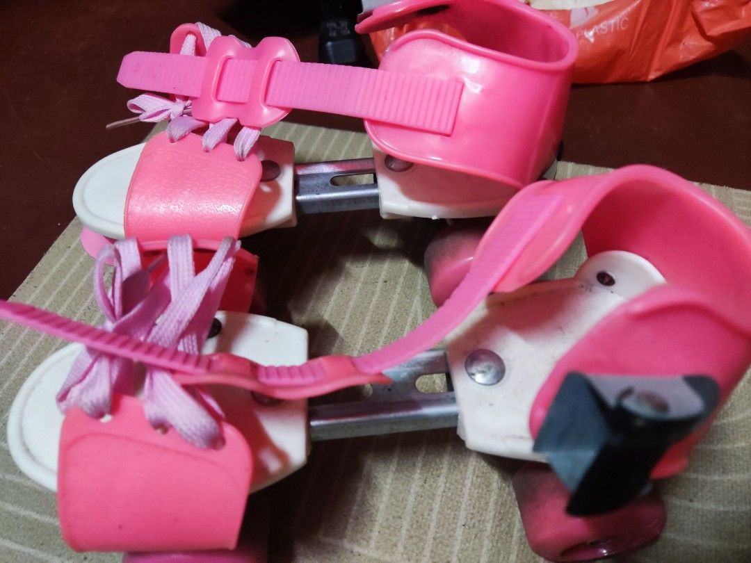 Pink Adjustable Roller Skates for Kids (Category: Skates, Rollerblades & Scooters) located in Pateros City. Submitted by starry__night__20951 (Listing ID 1461589210, Image 2). Description: - Adjustable roller skates for kids - Bright pink and white design - Secure fit with laces and velcro straps - Pink wheels - Ideal for learning to skate - Shows some scuffs on wheels from use, but still in great working condition and lots of fun left! Orig pric