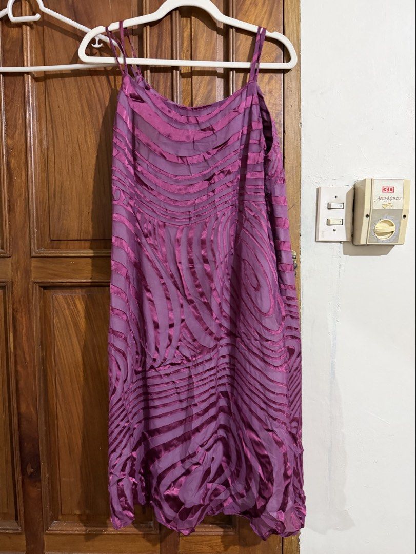 Plum spiral wavy design shift dress (Category: Dresses) located in Quezon City. Submitted by latiendadejaye (Listing ID 1461625617, Image 1). Description: Free size, can fit size M-L Very interesting design, with double strap and lining inside In good condition, never worn except to try it on. MOP: BPI, Gcash, Maya RFS: cleaning out my closet.