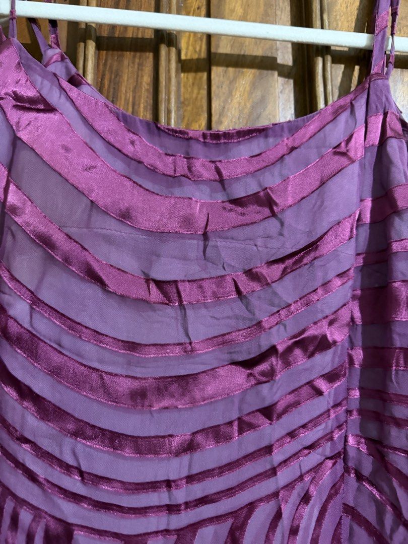 Plum spiral wavy design shift dress (Category: Dresses) located in Quezon City. Submitted by latiendadejaye (Listing ID 1461625617, Image 3). Description: Free size, can fit size M-L Very interesting design, with double strap and lining inside In good condition, never worn except to try it on. MOP: BPI, Gcash, Maya RFS: cleaning out my closet.