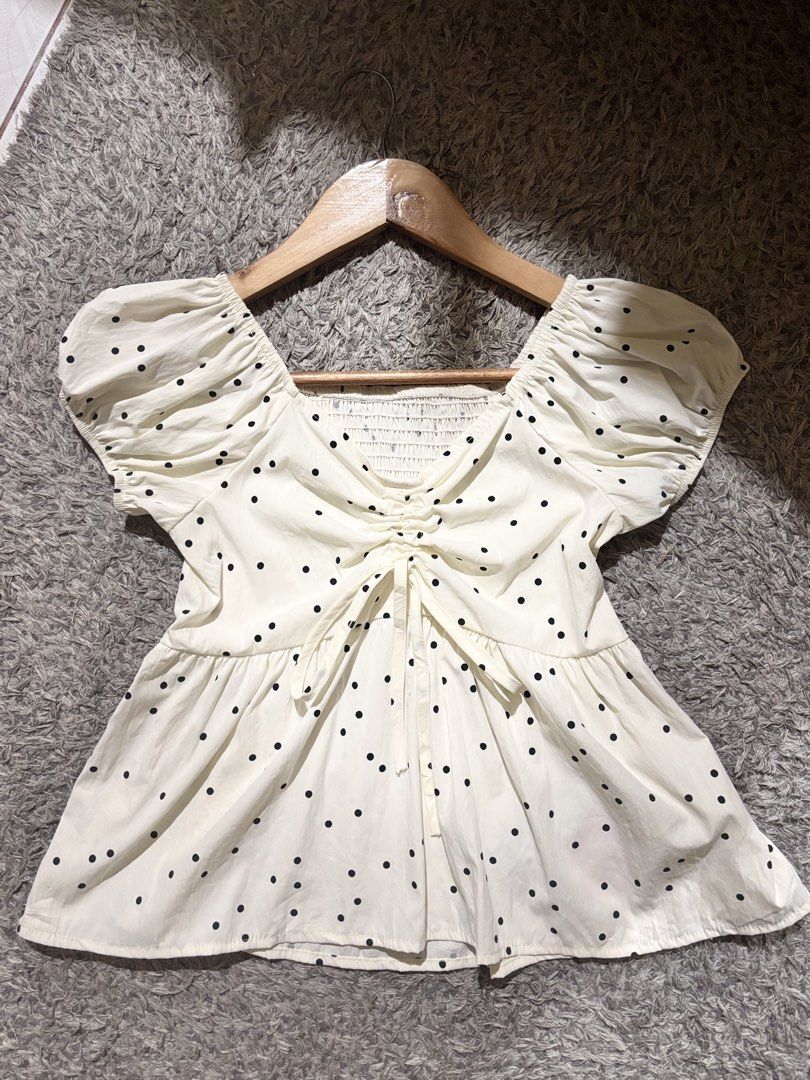 polka-dot puff-sleeve peplum top (Category: Blouses) located in Manila. Submitted by kattlacsamana (Listing ID 1461744115, Image 1). Description: For sale cream polka-dot puff-sleeve peplum top featuring center ruching and front tie details With tag/ So pretty in actual Size: S-M .