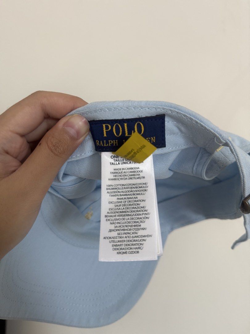 Polo Ralph Lauren Light Blue Cotton Cap (Category: Caps & Hats) located in Quezon City. Submitted by vynedeclutters (Listing ID 1461592738, Image 3). Description: - Light blue Polo Ralph Lauren cap - Iconic gold embroidered polo player logo on front - 'POLO' embroidered on the back - Adjustable strap for a comfortable fit - Made from 100% cotton.