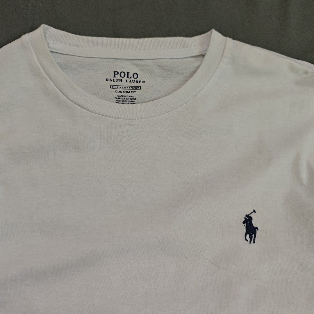 Polo Ralph Lauren White Long Sleeve (Category: Tshirts & Polo Shirts ) located in Ipil. Submitted by ajthriftfinds (Listing ID 1461686319, Image 2). Description: - Dimes: 19x26 - As new condition - No issue - Brand: Polo Ralph Lauren - Features iconic navy pony logo on chest - Crew neck - Long sleeves - Versatile for layering or wearing on its own.