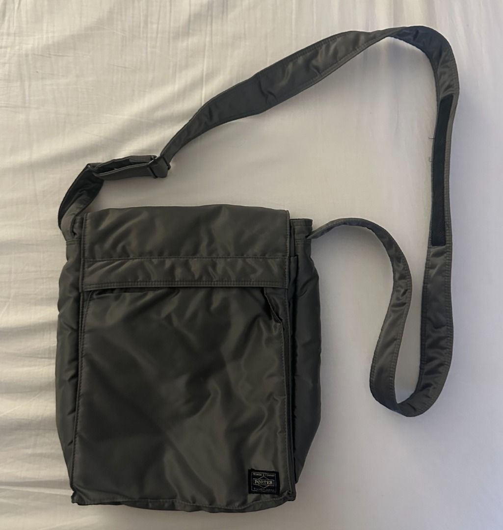 Porter Yoshida & Co. Nylon Messenger Bag (Category: Sling Bags) located in San Juan City. Submitted by looneyc (Listing ID 1461622195, Image 1). Description: - Grey Porter Yoshida & Co. messenger bag - Approximate dimensions: 12 inches tall x 10 inches wide - Made from durable nylon - Front flap with zippered pocket underneath - Adjustable shoulder strap for comfort - Ideal for daily use or travel - Ample space for essentials Just kept in storage