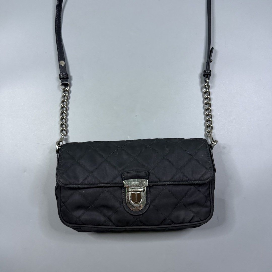 Prada - Black Tessuto Nylon Pushlock Chain Flap Bag (Category: Luxury Bags & Wallets) located in Paranaque City. Submitted by millennial_goodz (Listing ID 1461769887, Image 2). Description: WTS Prada - Black Tessuto Nylon Pushlock Chain Flap Bag Small size Can fit wallet and iPhone Pro Max's Rank AB Slight signs of usage Quilted nylon design (iconic on Prada's) DM.