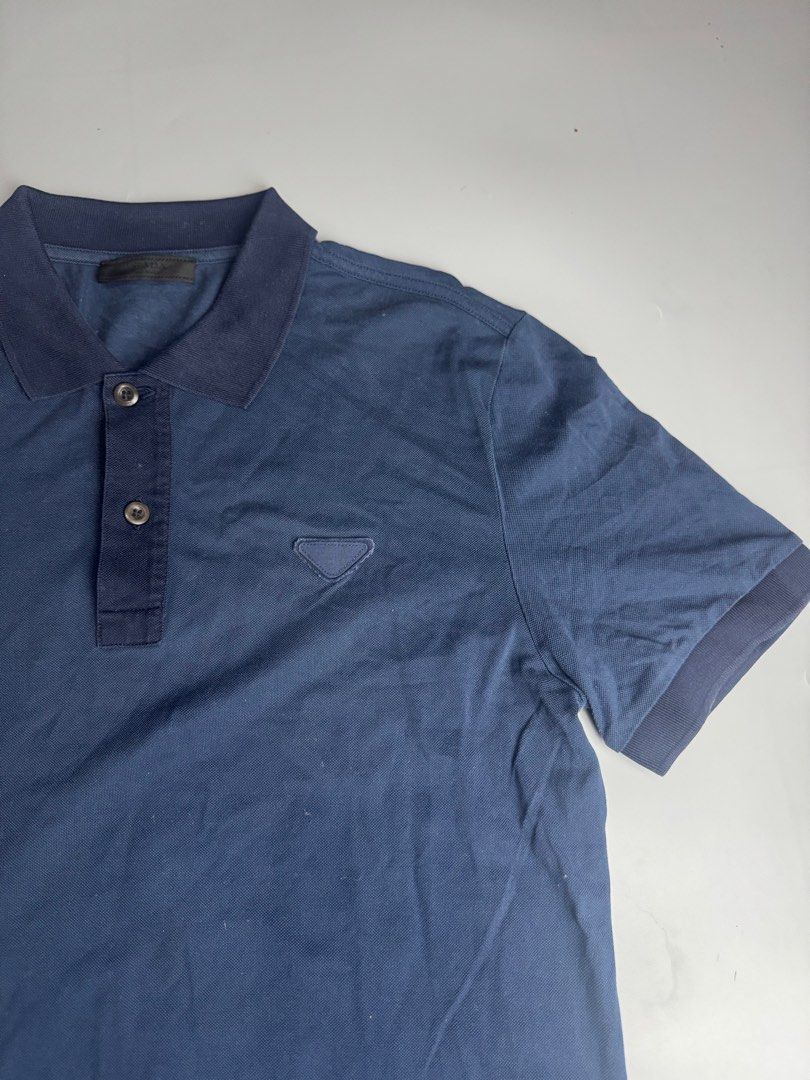 Prada - Pique Navy - Polo Shirt (Category: Luxury Apparel) located in San Pablo. Submitted by hiddenrygn (Listing ID 1461576337, Image 2). Description: Prada - Pique Navy - Polo Shirt Size : S (20” 28”) No major flaws Still in excellent condition Authentic DM!.