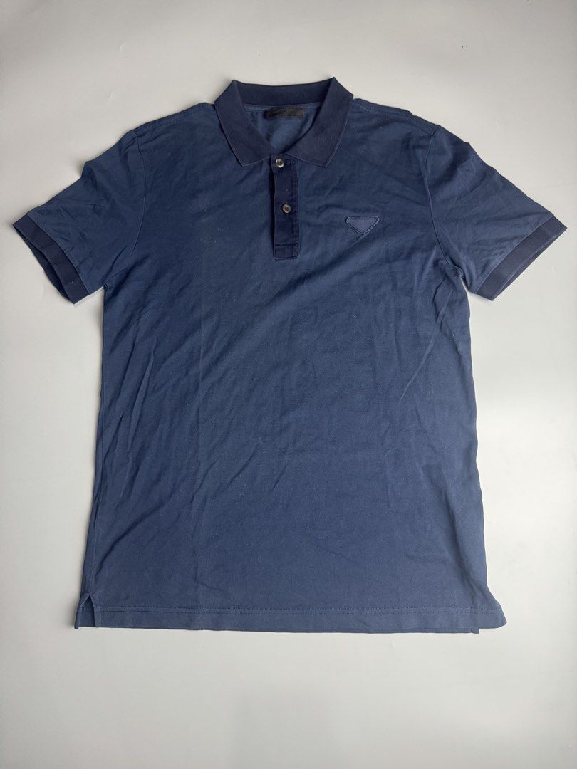 Prada - Pique Navy - Polo Shirt (Category: Luxury Apparel) located in San Pablo. Submitted by hiddenrygn (Listing ID 1461576337, Image 1). Description: Prada - Pique Navy - Polo Shirt Size : S (20” 28”) No major flaws Still in excellent condition Authentic DM!.