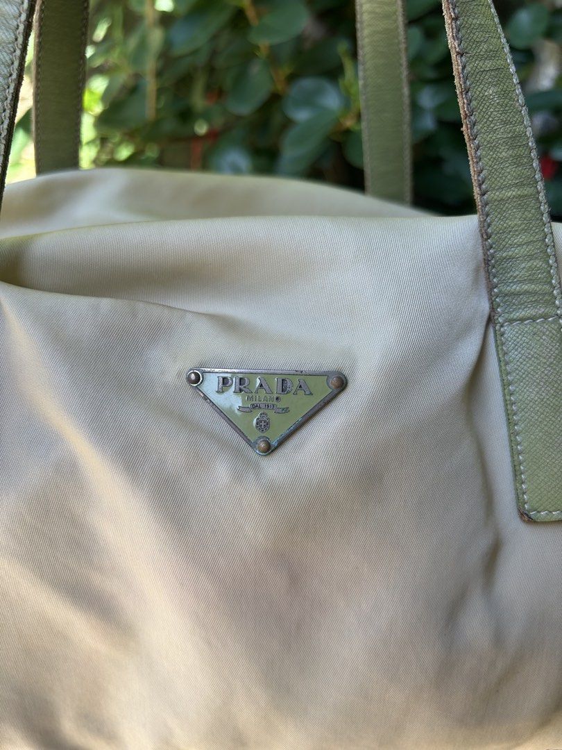 prada bag (Category: Shoulder Bags) located in San Antonio. Submitted by clinicallycute_. (Listing ID 1461626970, Image 2). Description: -Vintage Prada Boston Bag -Ivory/cream nylon with green leather handles -Made in Italy -With original tag + No. 8 tag -Condition: Good vintage condition -Issues: visible yellowing/discoloration on nylon + wear/darkening on leather handles/edges -Price: ₱13,500 negotiable -Selling as-is; please see photos for con