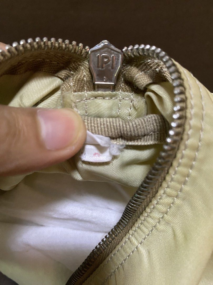 prada bag (Category: Shoulder Bags) located in San Antonio. Submitted by clinicallycute_. (Listing ID 1461626970, Image 3). Description: -Vintage Prada Boston Bag -Ivory/cream nylon with green leather handles -Made in Italy -With original tag + No. 8 tag -Condition: Good vintage condition -Issues: visible yellowing/discoloration on nylon + wear/darkening on leather handles/edges -Price: ₱13,500 negotiable -Selling as-is; please see photos for con